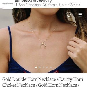 Gold double horn necklace